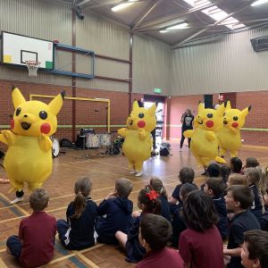 Just Add Music JAM Band performing at East Para Primary School with students in audience and pikachu characters