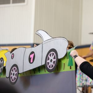 Cardboard car props in a JAM Band performance