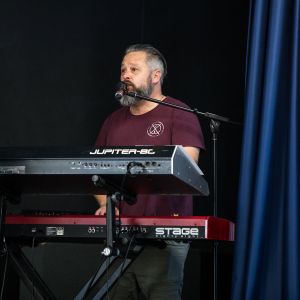 Jono Ruse from JAM Band singing and playing keyboard for a performance in Adelaide South Australia