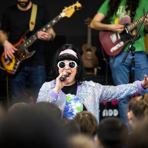 Nina Verlingieri in a disco costume singing and performing at a JAM Band show in Adelaide South Australia